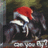 Pixelated image of a figure in Santa hat with text 'God Gave Us Horses So Girls Can Fly...' on blue background