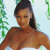 A pixelated contact sheet showing two frames of an animated icon featuring a woman in a white bikini top on the left and green text reading "Original Icons .com" on the right against a dark background.