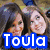 Two women appear in multiple with overlaid text reading "Toula Loves Megan and Liz" in colored fonts