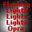 Red text reading "Flashing Lights Lights Lights Opera" on a dark gray gradient background with white light effects.
