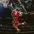 Animated sequence of a figure in red and gold attire performing a dynamic pose against a dark background with abstract shapes.