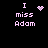 Pixelated text 'I miss Adam' in light purple on black background with animated heart and starburst symbols.