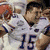 Pixelated image of a football player in white jersey with number 15, alongside orange and blue text reading "Tebow is the Gators are the Best in the BCS BCS Champs" with a green alligator logo