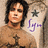 Pixelated image of a person with long dark hair wearing a brown top, with visible tattoos and purple text on the right side.