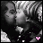 Two side-by-side pixelated images of a person with dark hair and light clothing, one featuring a pink heart symbol at the bottom center.