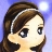 Pixelated close-up of a character with brown hair and a white headband against a blue background.