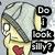 Pixelated cartoon character with gray helmet, red heart on chest, and hand near mouth; text "Do I Look Silly?" appears in left