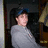 Pixelated image of a person in a gray shirt and dark cap with blue text reading "See this boy? i love him to death. may 11 2007 <3" on black background.