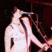 A split-screen image shows a person singing into a microphone on the left and playing guitar with spiky hair on the right, below which is text reading "I ❤️ Brody".