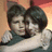 Two people embrace in a pixelated 4- ; the right displays "I LOVE YOU" text over their faces
