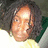 A pixelated image of a person with curly hair wearing a white and green shirt, transitioning from no text to displaying 'chyeh.' in cyan.