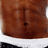 A pixelated image of a person with a muscular torso and a white towel draped over their shoulder, with red text reading 'CoolBuddy.com' in the bottom right corner.