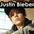 A pixelated image of a person wearing a dark cap and gray jacket, with text overlays reading "Justin Bieber" and "One Time" in black and white.
