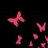 Pixelated pink shapes on a black background, including a cross-like form and scattered fragments.