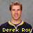 A pixelated image of a person in a dark jersey with yellow and white trim, showing text overlays reading 'Derek Roy', '# 9', and 'Sabres' across different sections.