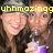 A pixelated image of a person with long brown hair wearing a gray cap and holding a purple object, overlaid with yellow text.