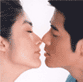 Two people in close proximity with eyes closed, faces nearly touching against a white background with overlaid text.