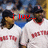 Two baseball players in white uniforms with red lettering stand side-by-side, text overlays change across frames.