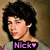 Pixelated image of a person with dark hair wearing a black shirt with purple text and a heart symbol.