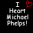 Black background with white pixelated text reading "I Heart Michael Phelps!" and a red heart symbol replacing the word "Heart" in one view.
