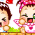 Pixelated cartoon baby with brown hair, pink headband, and heart-patterned clothing, smiling with closed eyes and raised hands.