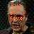 A four- pixelated image with orange text overlays on a dark background, showing a person in three and a blank