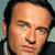 A 2x2 contact sheet of a static image featuring two men's faces in the top row and red text reading 'nip/tuck' on a white background in the bottom left, with a gray transparency placeholder in the bottom right.