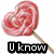 A heart-shaped pink lollipop with white swirls on a wooden stick appears in four , each displaying different text below it