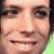 Pixelated close-up of a person's face showing eyes, nose, mouth, and part of the forehead with visible pixelation and color blending.