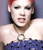 A 4-frame animated contact sheet showing a person with red hair in a blue strapless dress, transitioning from full-body to cropped views with text appearing below.