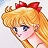 Pixelated anime-style character with blonde hair, red bow, blue eyes, and pink cheeks in profile view against light background