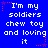 Blue background with white pixelated text reading "I'm my soldiers chew toy and loving it" repeated in six , each bordered by red star-shaped dots