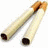 Two cigarettes with brown filters and black tips lie diagonally on a white background, next to green pixelated text reading 'Smoking Kills' on light green.