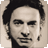 Pixelated grayscale portrait of a person with dark hair styled upward, neutral expression, visible ear and neck, cropped to head and shoulders.
