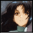 Pixelated image of a person with dark hair and light skin wearing a teal top, next to text reading 'AnimeIM.com' on a black background.