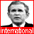 nine grayscale portraits with red borders, each showing a man in a suit with varying facial expressions and text overlays reading 'international' and 'terrorist' in pixelated red bands