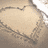 A static pixelated image of a heart-shaped object with textured edges against a muted background.