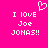 Bright pink background with white pixelated text reading "I LOVE Joe JONAS!!" and a pixelated heart symbol above the text.