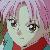 Pixelated close-up of a character with large eyes, light skin, and dark hair, wearing a red garment with a teal collar against a blurred pastel background.