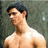 A split- image shows a shirtless man with dark hair on the left and his torso on the right, below text reading "Marry me<3" in yellow font
