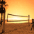 Animated beach volleyball scene at sunset with silhouetted players, net, and palm trees against an orange sky.