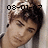 Pixelated image of a person with short dark hair, closed eyes, and a neutral expression, overlaid with black digital date text.