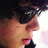 A pixelated image shows a person's profile on the left with dark hair and glasses, next to text reading 'the cute sensitive one' with a pink heart symbol.