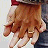 A contact sheet of two animated frames showing a person's hands holding another person's hand, with the text "hold me" in pixelated font on the right side.