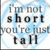 Pixelated text reads "i'm not short you're just tall" on a white background with light blue circular gradient accents.