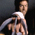 A pixelated image shows a person holding a microphone against a dark background, with green text reading 'Original Icons .com' on the right side.