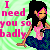Pixelated static image featuring a cartoon woman with long black hair and pink eyeshadow holding a small pink object against a green background, with bold pink text reading "I need you so badly" on the left side.