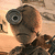Pixelated image of a character with large round eyes, brown hair, and a dark outfit against a light background.