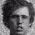 Three black-and-white headshots of men with varied hairstyles and facial features arranged in a