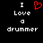Black background with white pixelated text "I Love a drummer" and a red pixelated heart symbol replacing the word "love" in the left